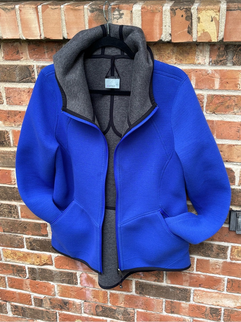 Athleta Reversable Hoodie Jacket . Full Zip, Front Pockets Longer back. size Lg.